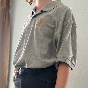 University of Texas polo top. Grey with university emblem. Size large.